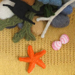 photo of knitted beach with sand