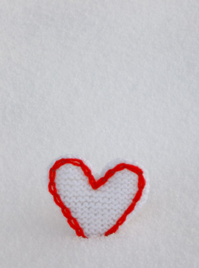 photo of two tone heart decoration in the snow