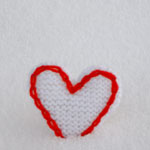 photo of heart decoration in snow